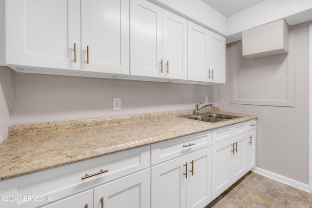 kitchen with white cabinets and sink