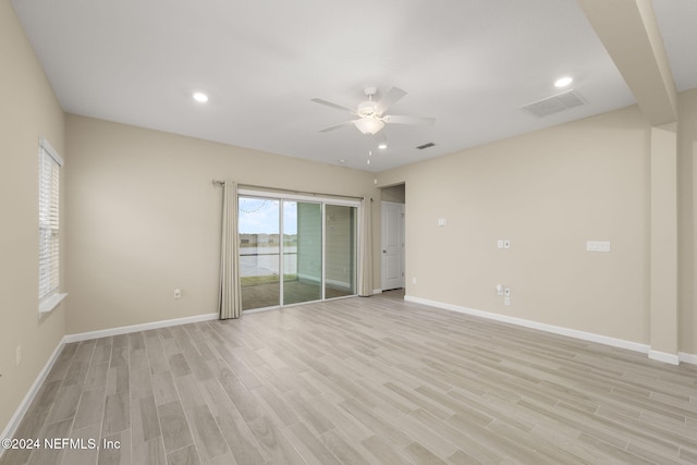 unfurnished room with ceiling fan and light hardwood / wood-style floors