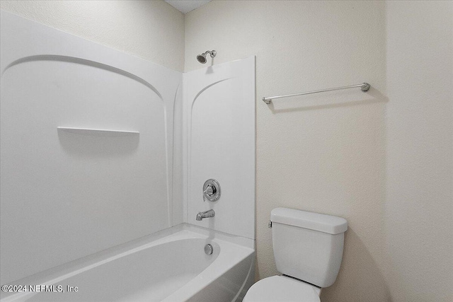 bathroom with shower / bathtub combination and toilet