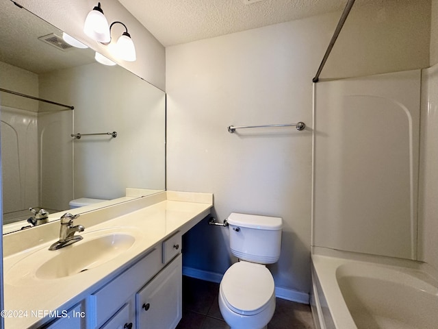 full bathroom with vanity, tile patterned floors, toilet, a textured ceiling, and tub / shower combination