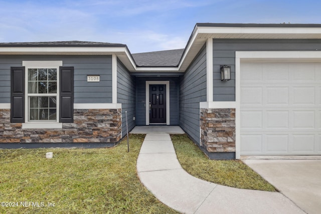 doorway to property featuring a garage