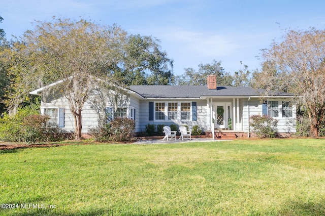 single story home with a patio and a front lawn