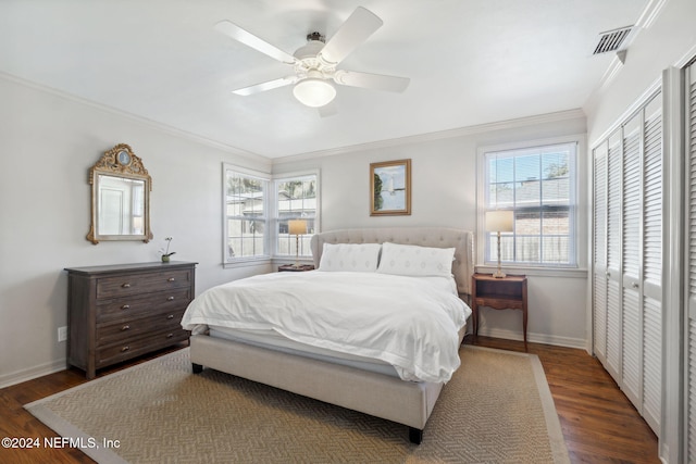 bedroom featuring dark hardwood / wood-style floors, a closet, and ceiling fan