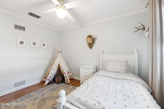 bedroom featuring ceiling fan, wood-type flooring, and ornamental molding