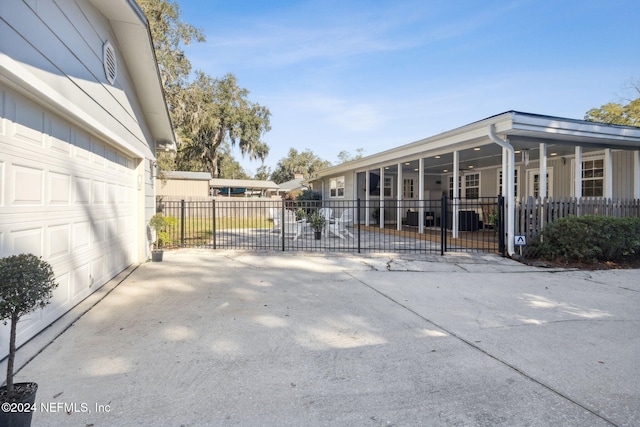 view of patio / terrace featuring a sunroom