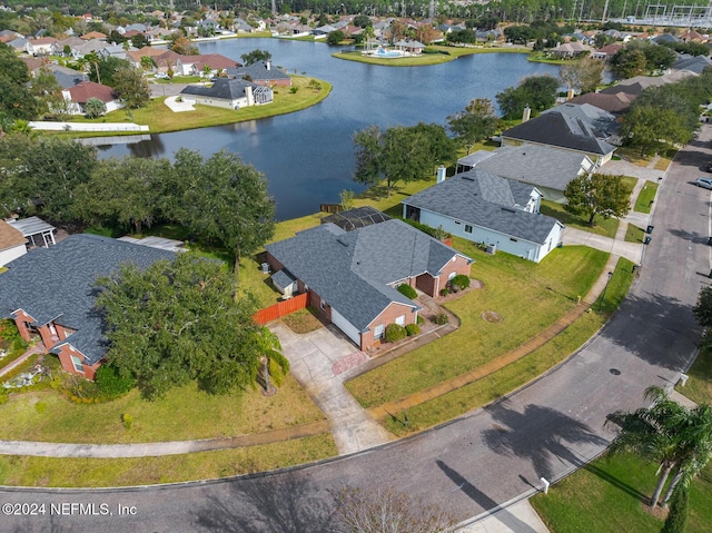 birds eye view of property featuring a water view