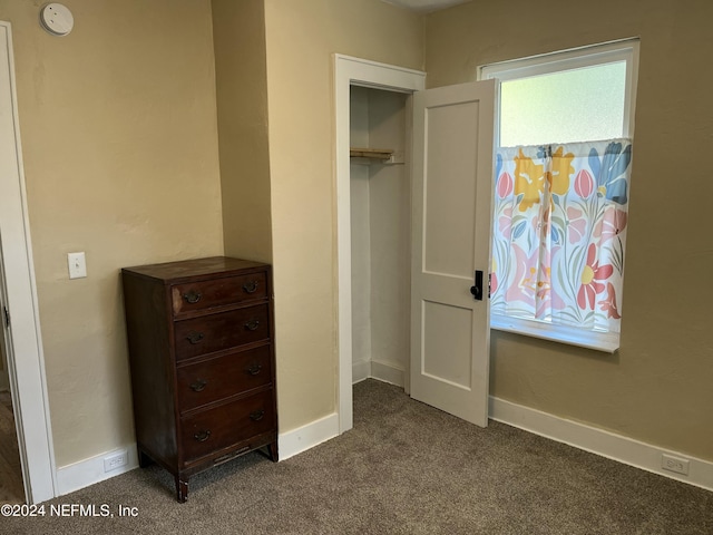 carpeted bedroom featuring a closet