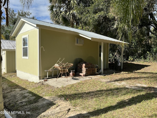 view of outbuilding featuring a yard