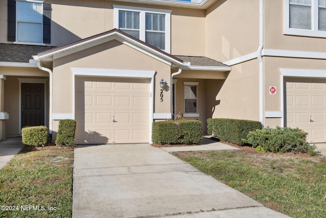 doorway to property featuring a garage