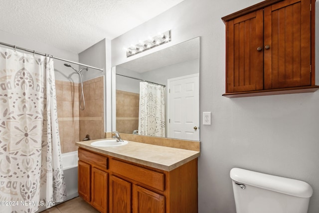 full bathroom featuring vanity, tile patterned flooring, toilet, shower / bathtub combination with curtain, and a textured ceiling