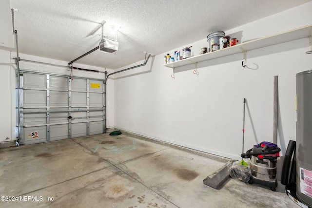 garage featuring water heater and a garage door opener