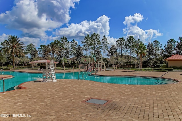 view of pool featuring a patio