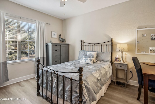 bedroom featuring hardwood / wood-style flooring and ceiling fan