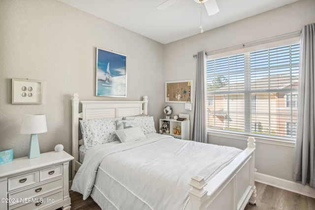 bedroom featuring hardwood / wood-style floors and ceiling fan