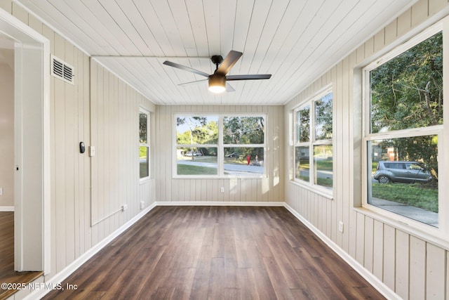 unfurnished sunroom featuring ceiling fan and wooden ceiling