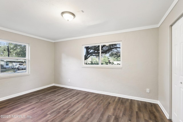 unfurnished bedroom featuring a closet, dark hardwood / wood-style flooring, and ornamental molding