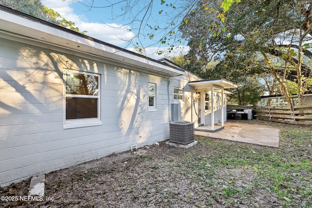 view of property exterior with a patio and cooling unit