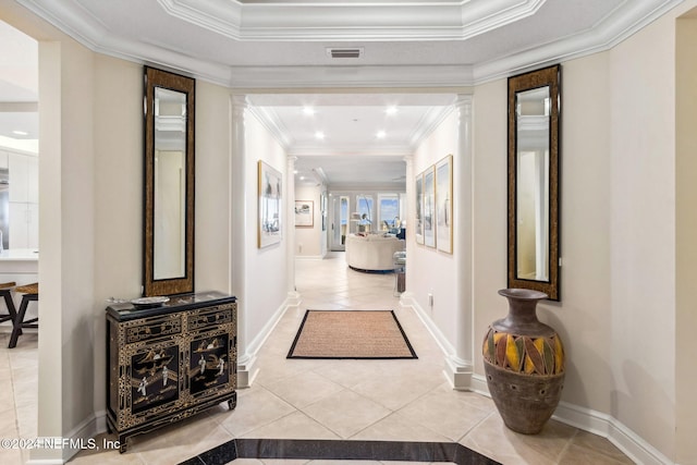 hall with light tile patterned floors and ornamental molding