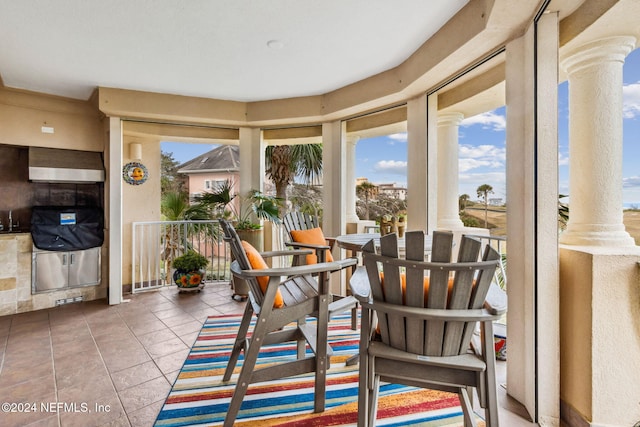 sunroom featuring ornate columns