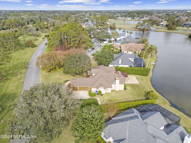 birds eye view of property with a water view