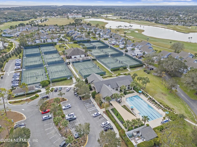 birds eye view of property with a water view