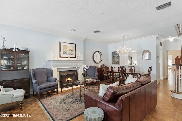 living room featuring crown molding, parquet floors, a chandelier, and a textured ceiling