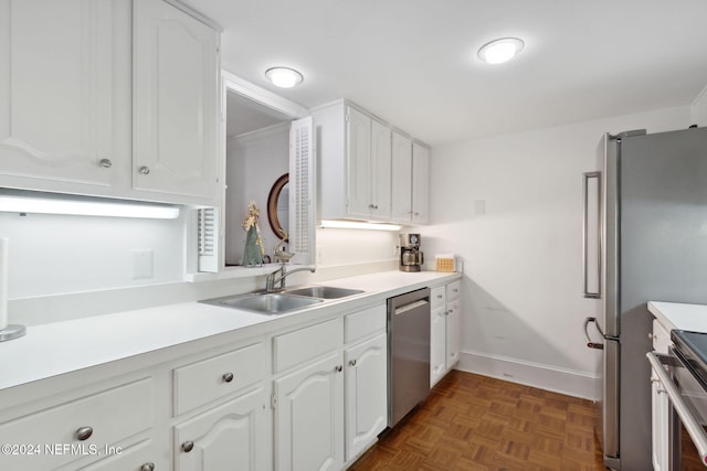 kitchen featuring white cabinets, dark parquet floors, stainless steel appliances, and sink