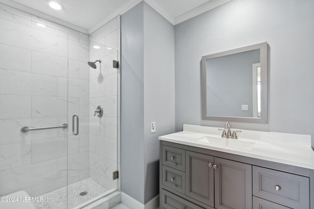 bathroom with vanity, crown molding, and walk in shower