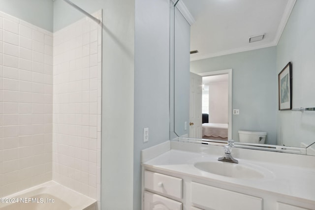 full bathroom featuring vanity, tub / shower combination, toilet, and ornamental molding