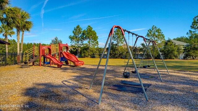 view of playground featuring a lawn