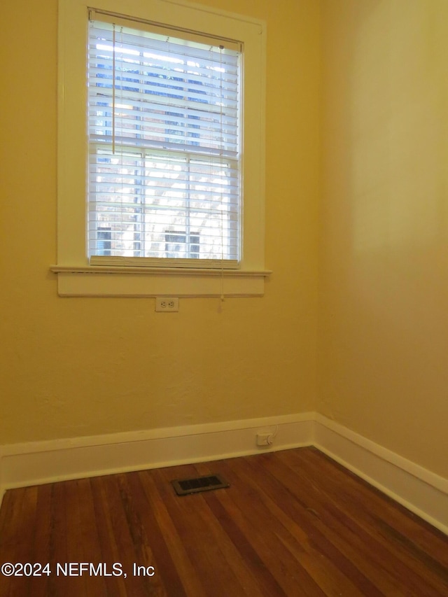 spare room with hardwood / wood-style floors