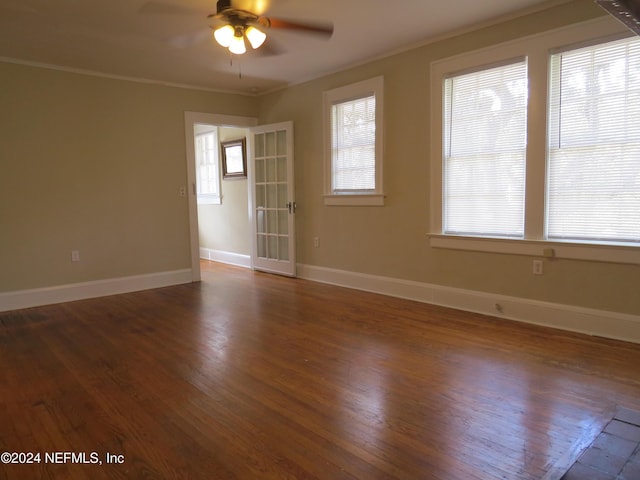 spare room with ceiling fan, crown molding, and dark hardwood / wood-style floors