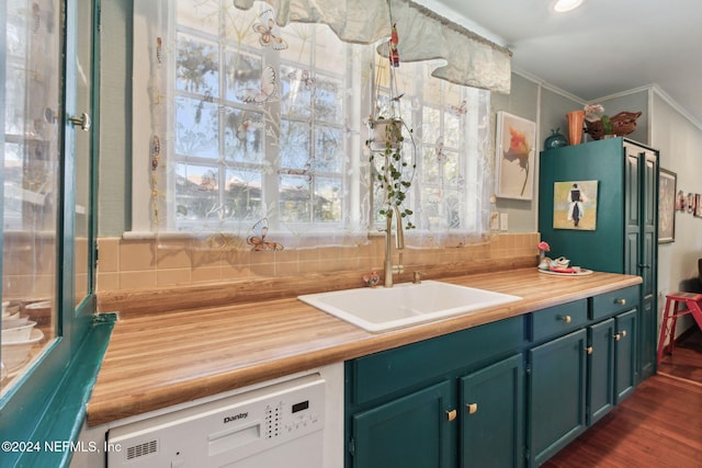 kitchen featuring wood counters, backsplash, dishwasher, ornamental molding, and sink