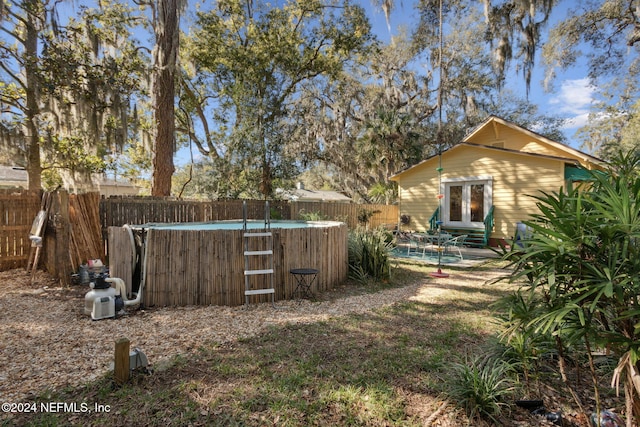 view of yard featuring a fenced in pool