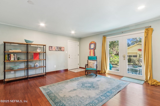 sitting room featuring dark hardwood / wood-style flooring and french doors