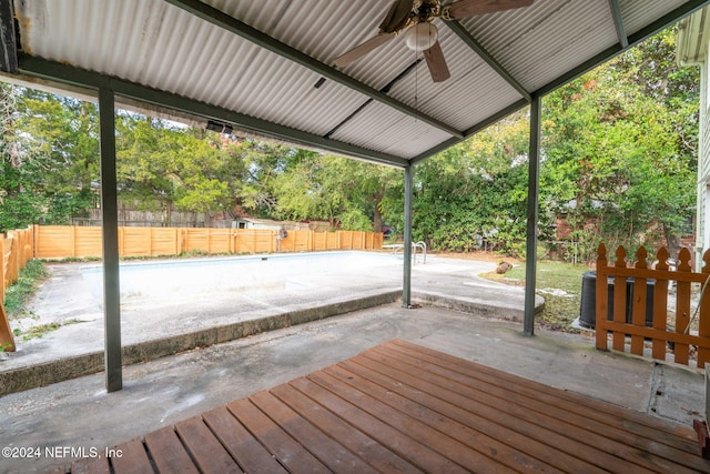 wooden terrace with a patio and ceiling fan