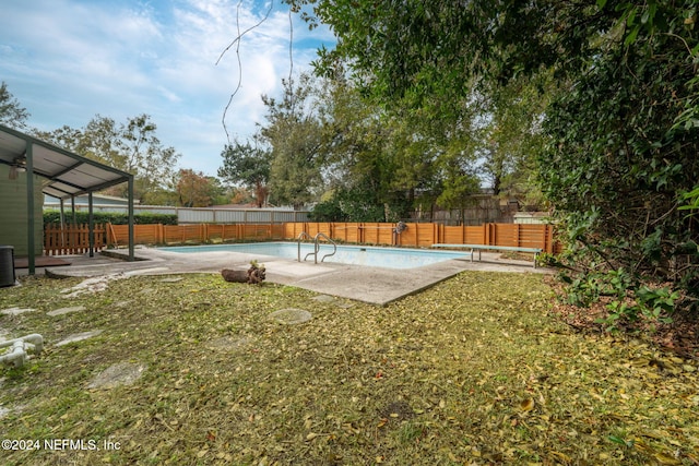 view of yard with a fenced in pool, cooling unit, and a patio