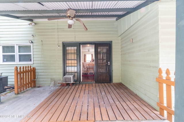 doorway to property with ceiling fan