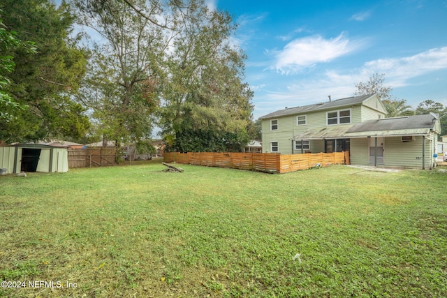 view of yard with a storage unit