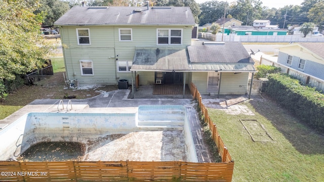 rear view of property with central air condition unit and a patio area