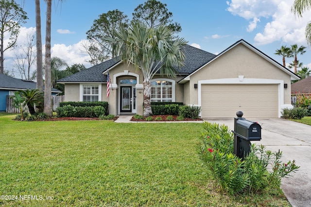 single story home featuring a garage and a front lawn