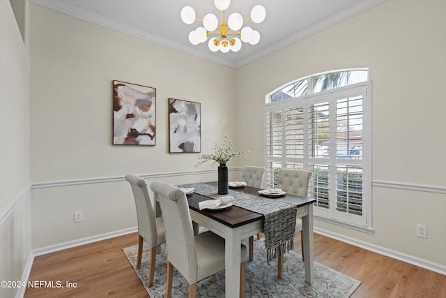 dining area featuring plenty of natural light, a chandelier, and light wood-type flooring