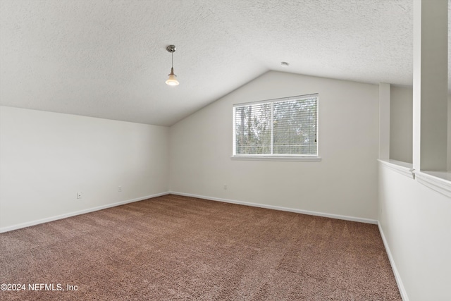 bonus room featuring carpet, a textured ceiling, and vaulted ceiling