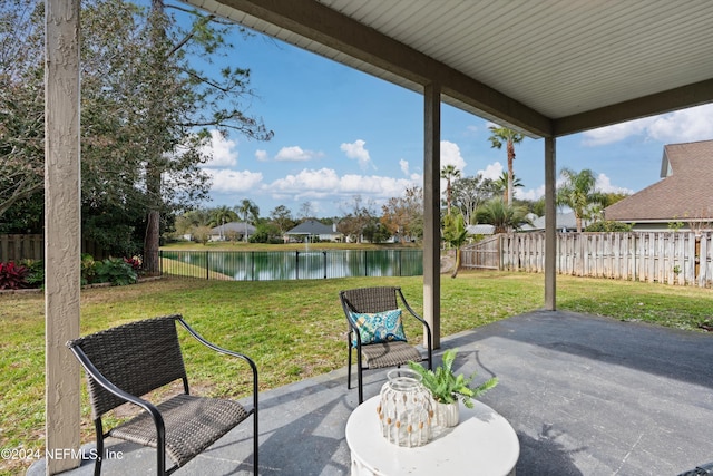 view of patio featuring a water view