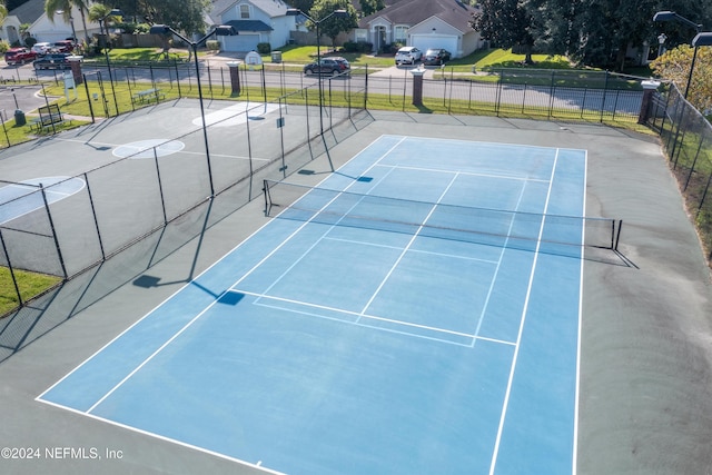 view of sport court featuring basketball hoop