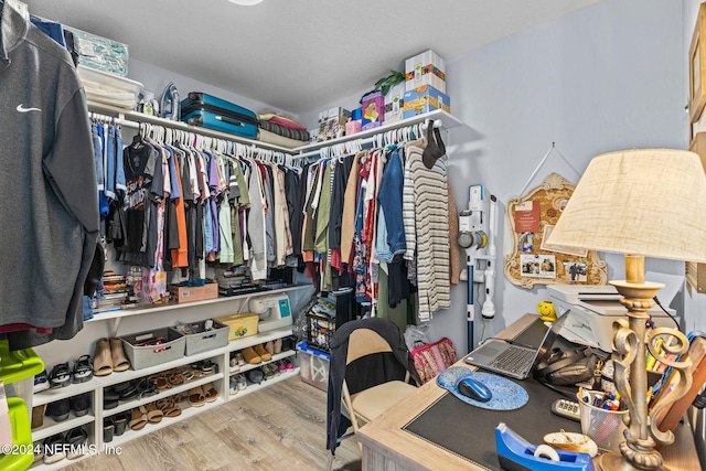 walk in closet featuring hardwood / wood-style flooring