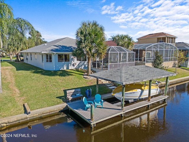 view of dock featuring a lawn, a lanai, and a water view