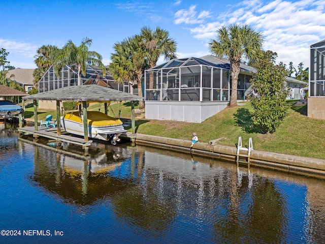 view of dock featuring a water view, a lanai, and a lawn