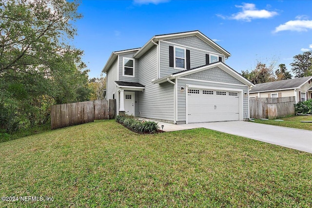 front of property featuring a front yard and a garage