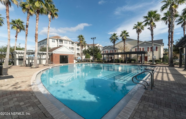 view of swimming pool featuring a patio